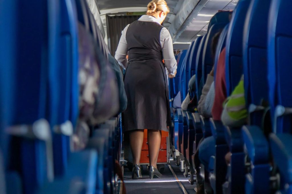 A woman walking on a plane